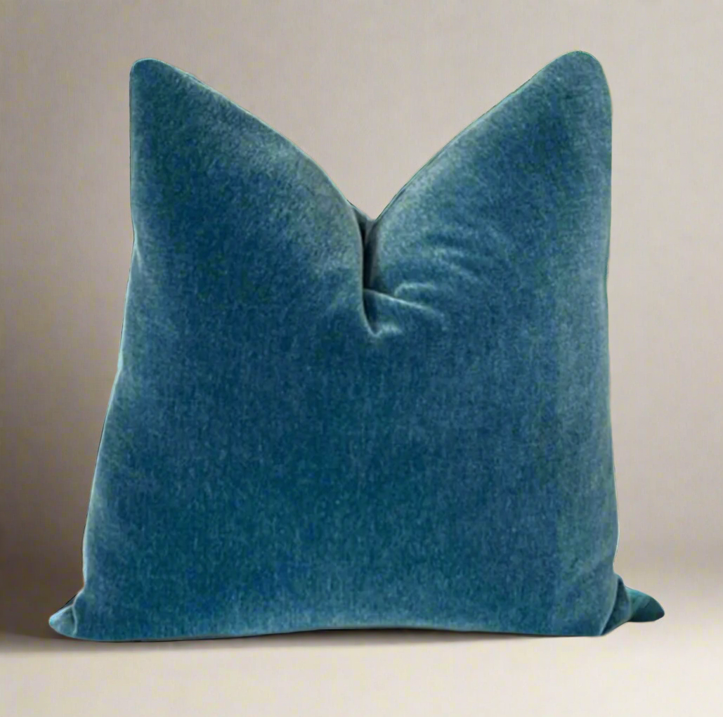 A blue mohair throw pillow