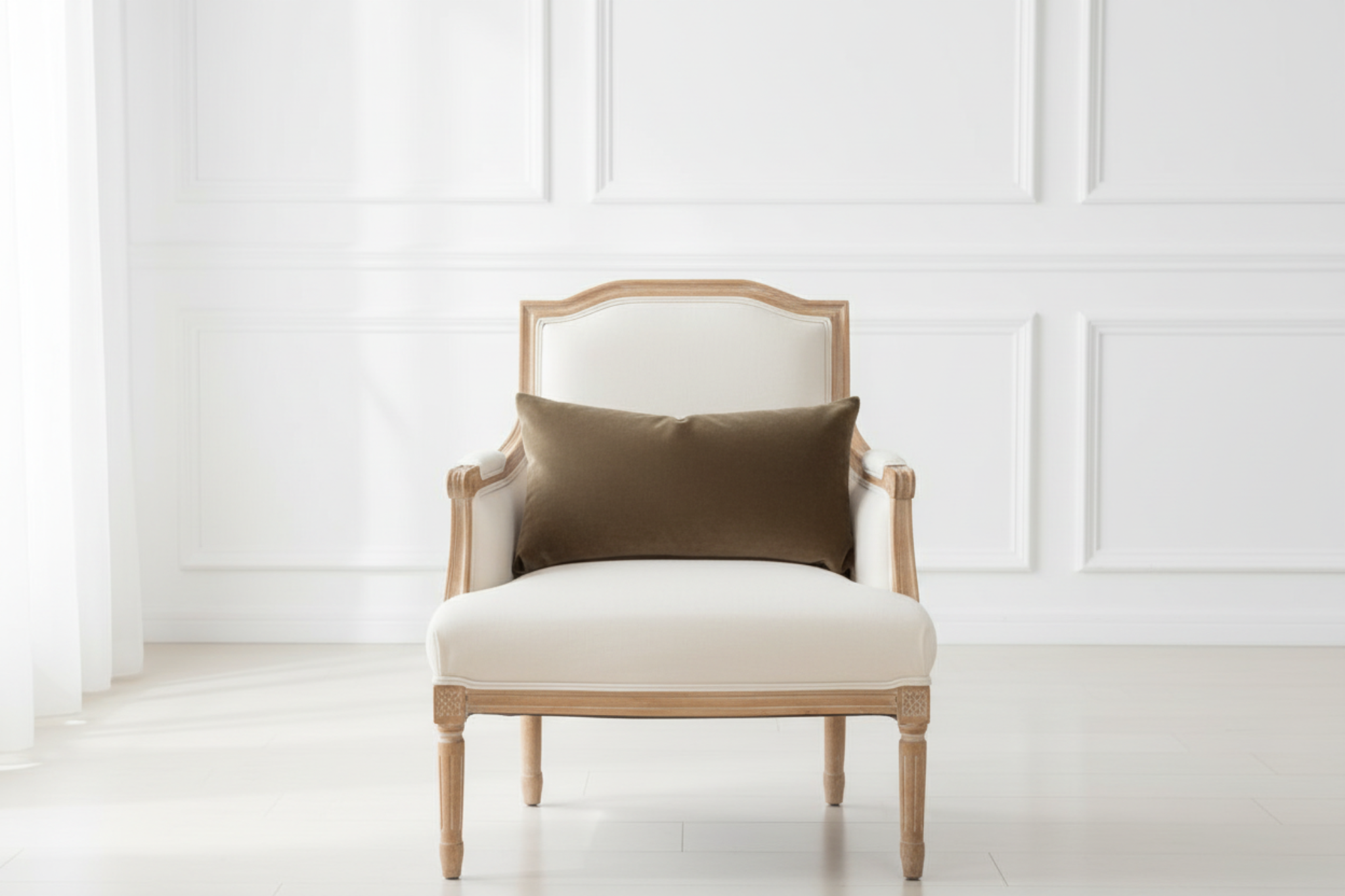 Chair with a brown pillow against a white paneled wall