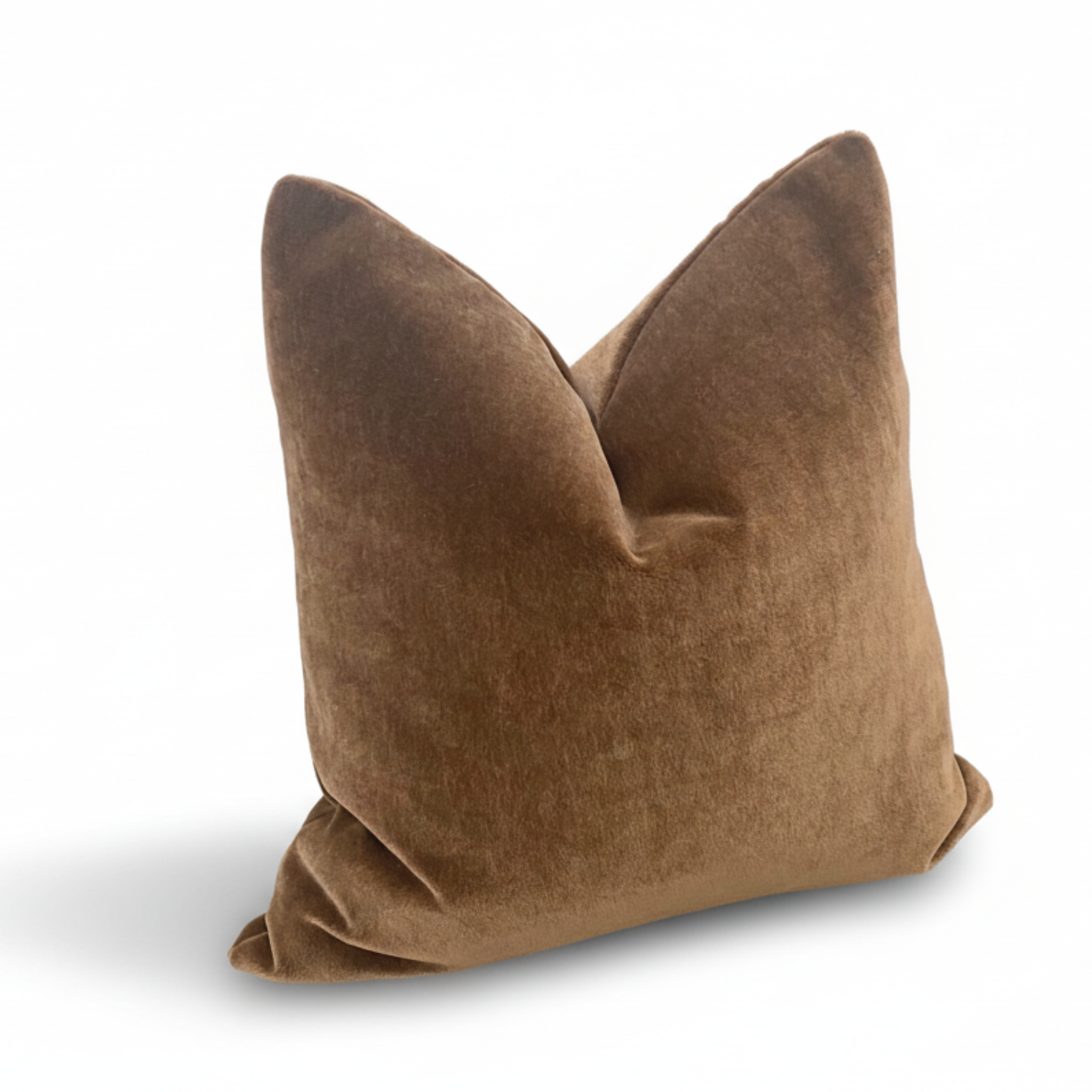 Brown velvet pillow on a white background
