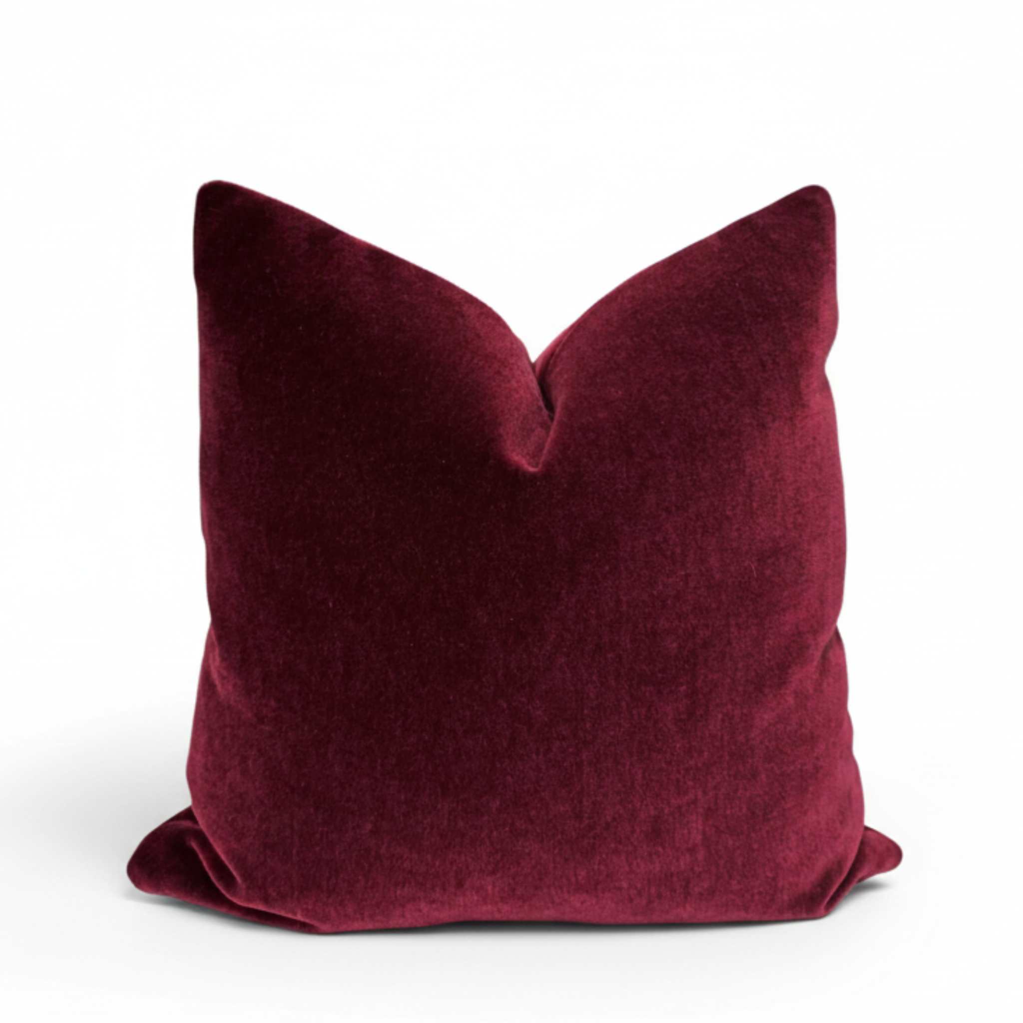 Maroon pillow on a white background